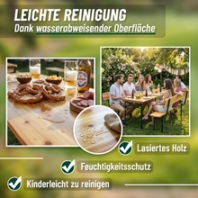 An der VOSS.garden Bierzeltgarnitur mit Rückenlehne 170cm wird im Freien gegessen; Nahaufnahmen zeigen Wassertropfen auf der leicht zu reinigenden, klappbaren Oberfläche des Holztisches.